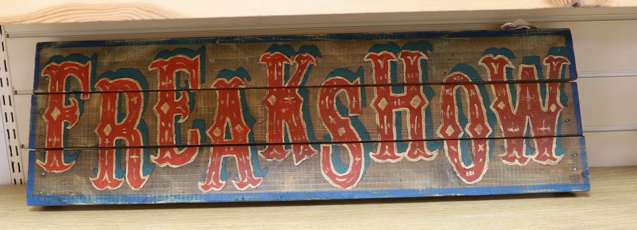 A 'Freak Show' painted wood sign, 27x89cm
